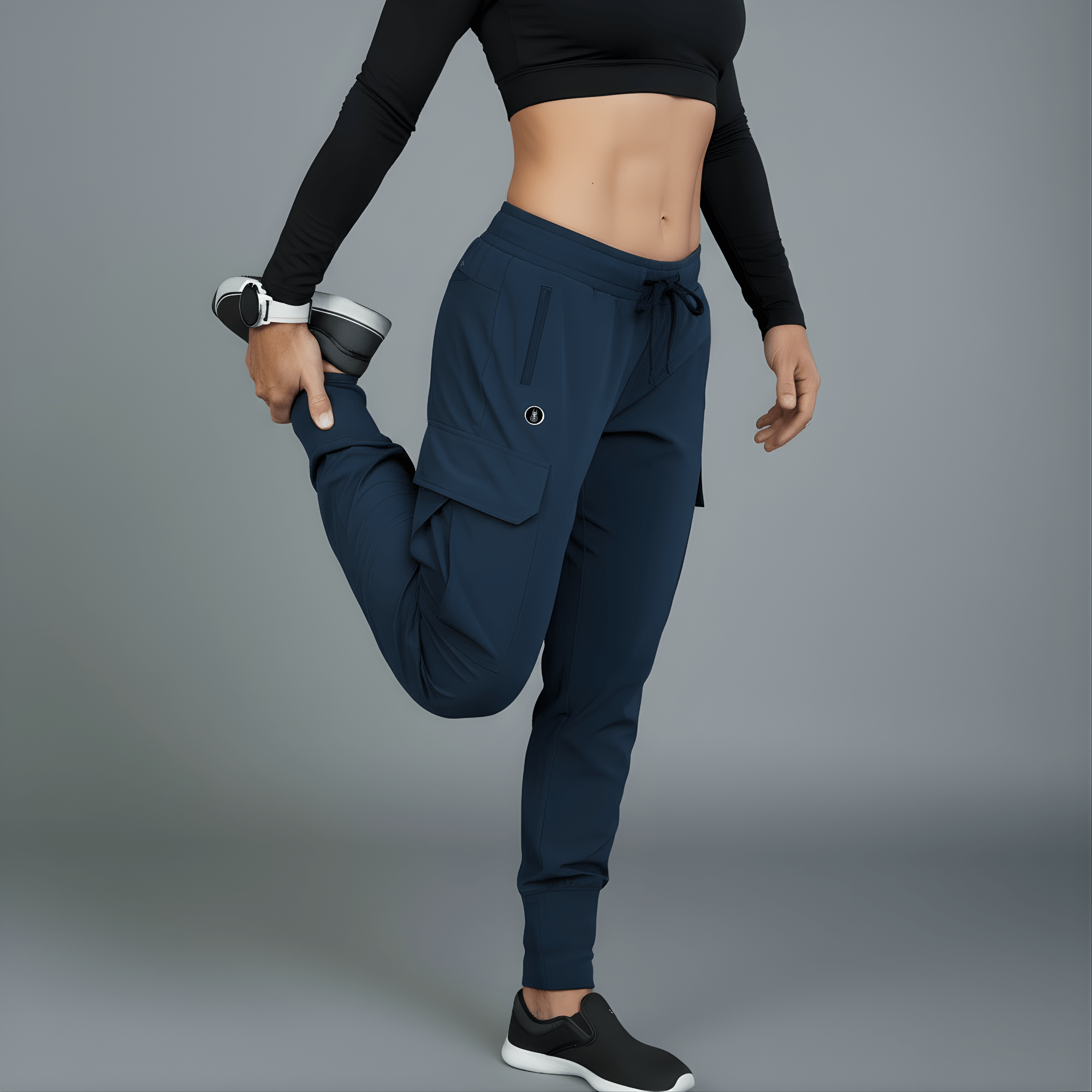 Person wearing navy jogger pants and black long-sleeve top on a gray background