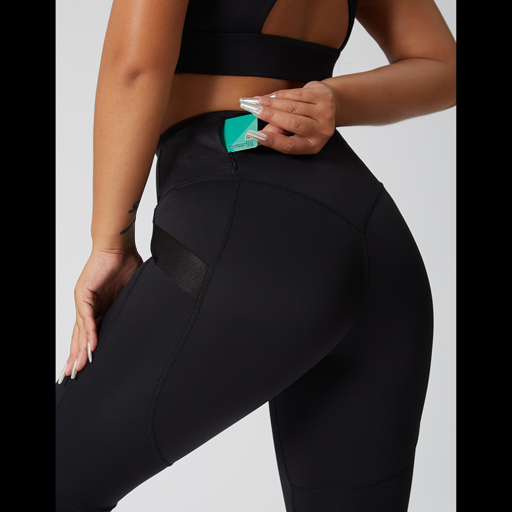 a closer view of the back of the black leggings showing a small pocket in the back.