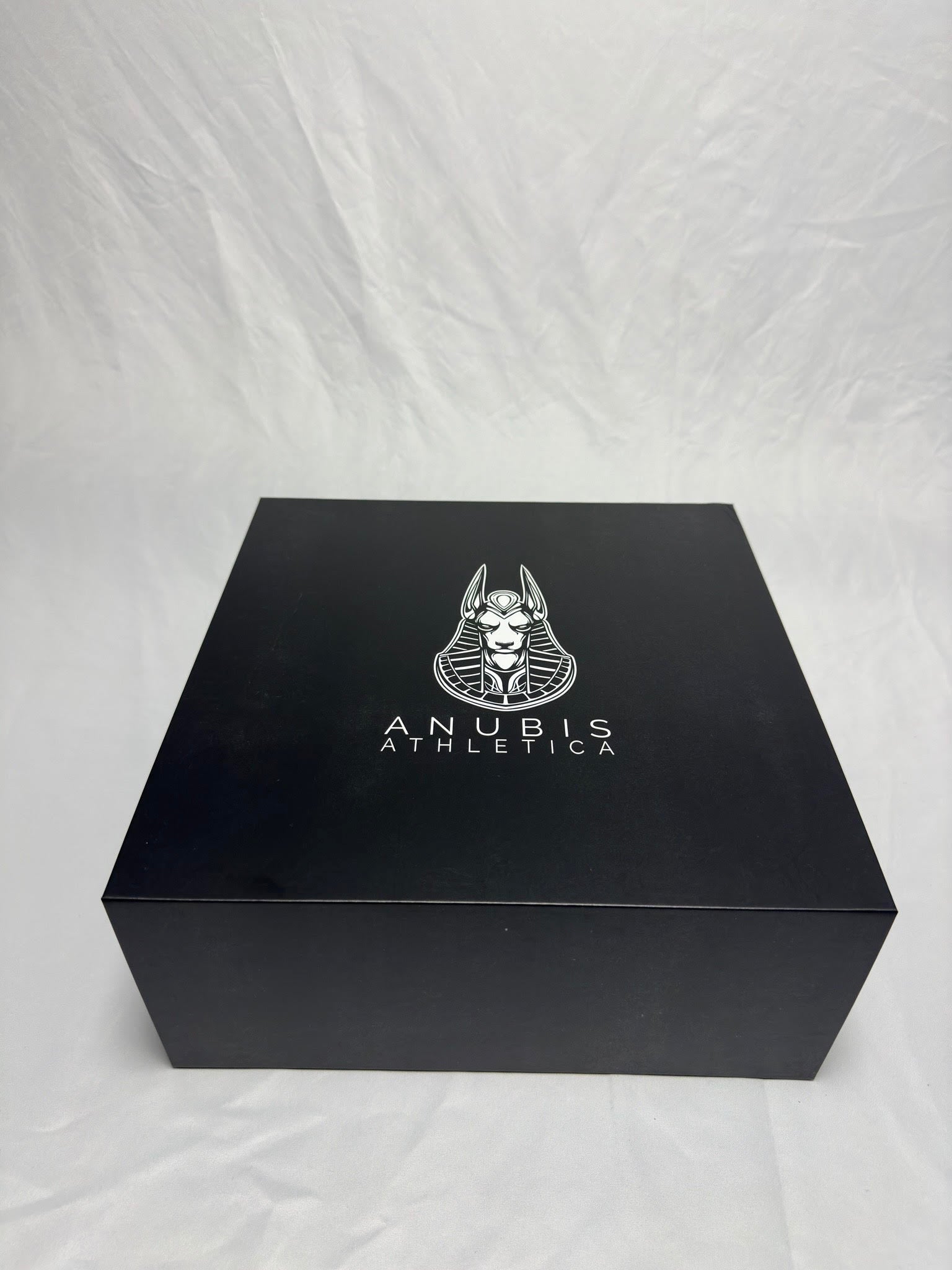 the large black box the hoodies are sent in with a white print of the company logo in the center