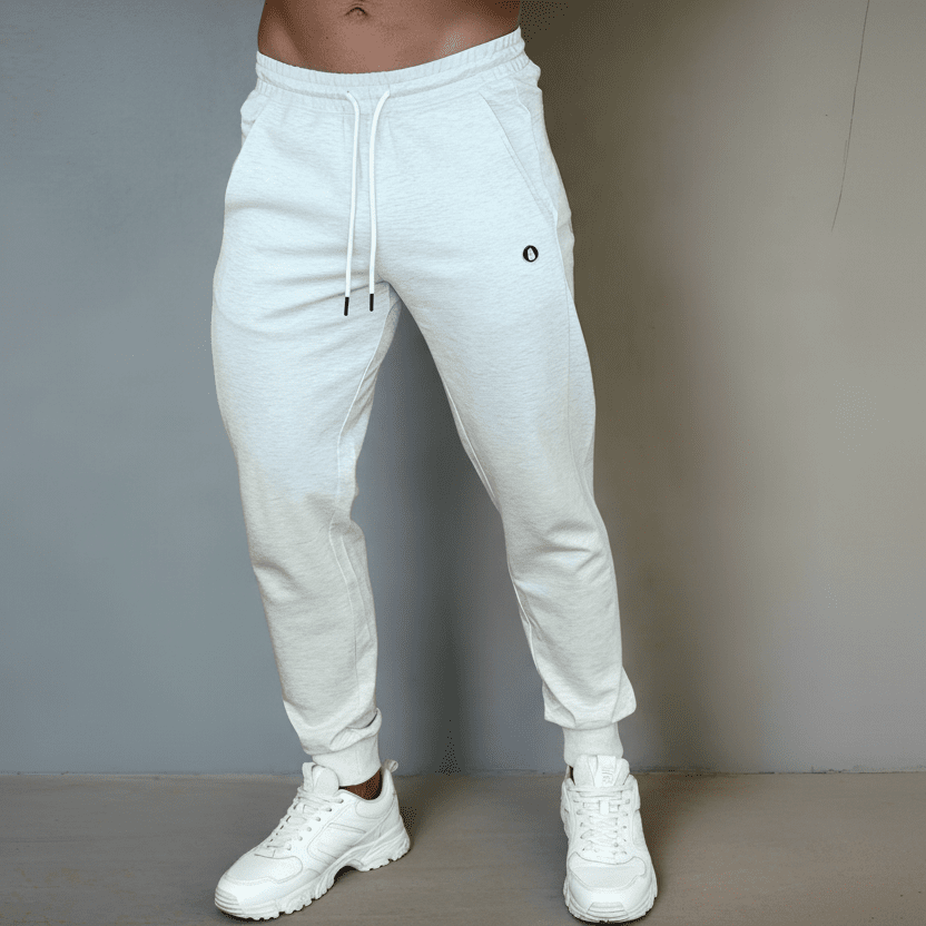 White jogger pants worn by a person against a neutral background