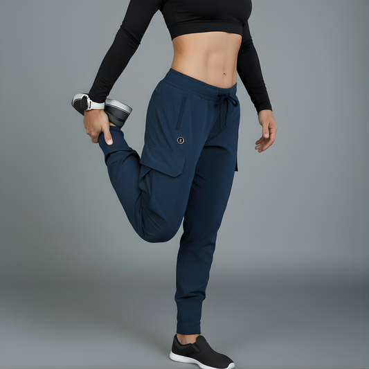 Person wearing navy jogger pants and black long-sleeve top on a gray background