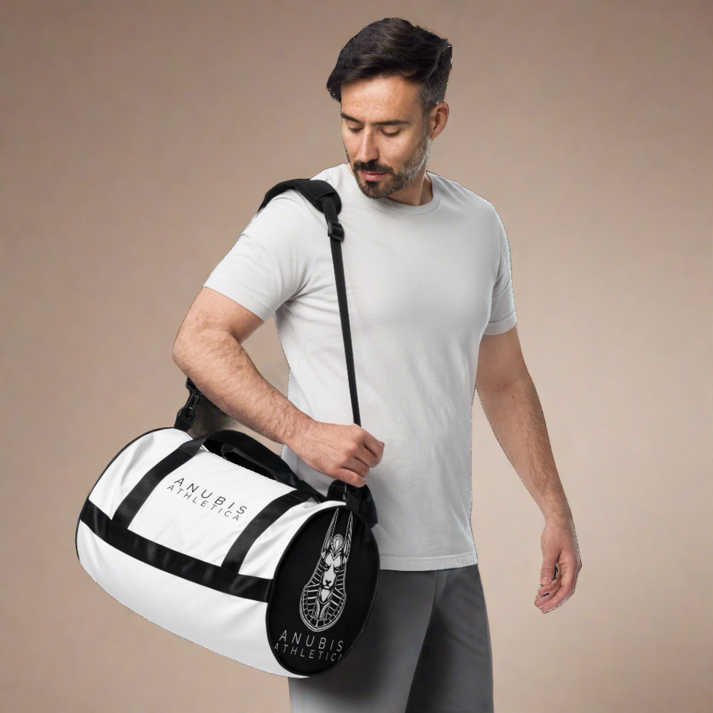 Man holding a Medium sized white gym bag