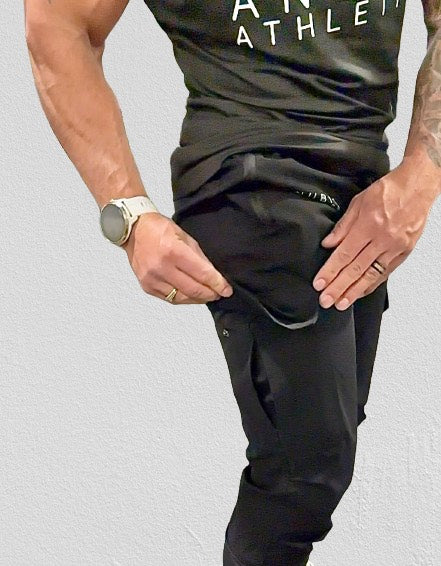 male model wearing black cargo joggers