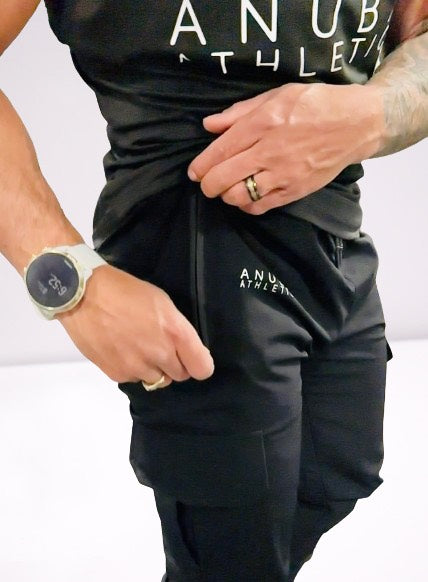 male model wearing black cargo joggers