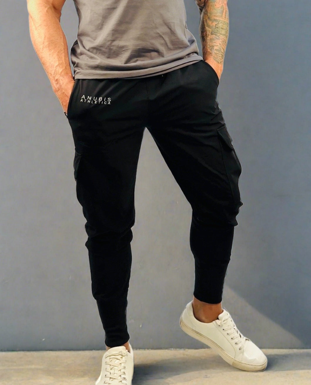 male model wearing black cargo joggers