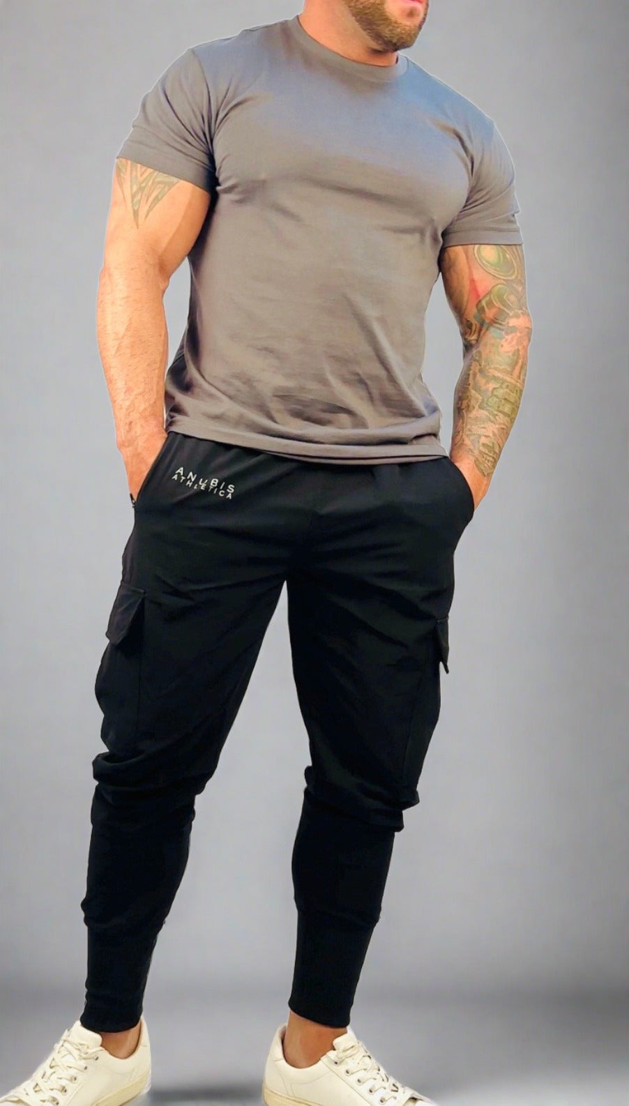 male model wearing black cargo joggers