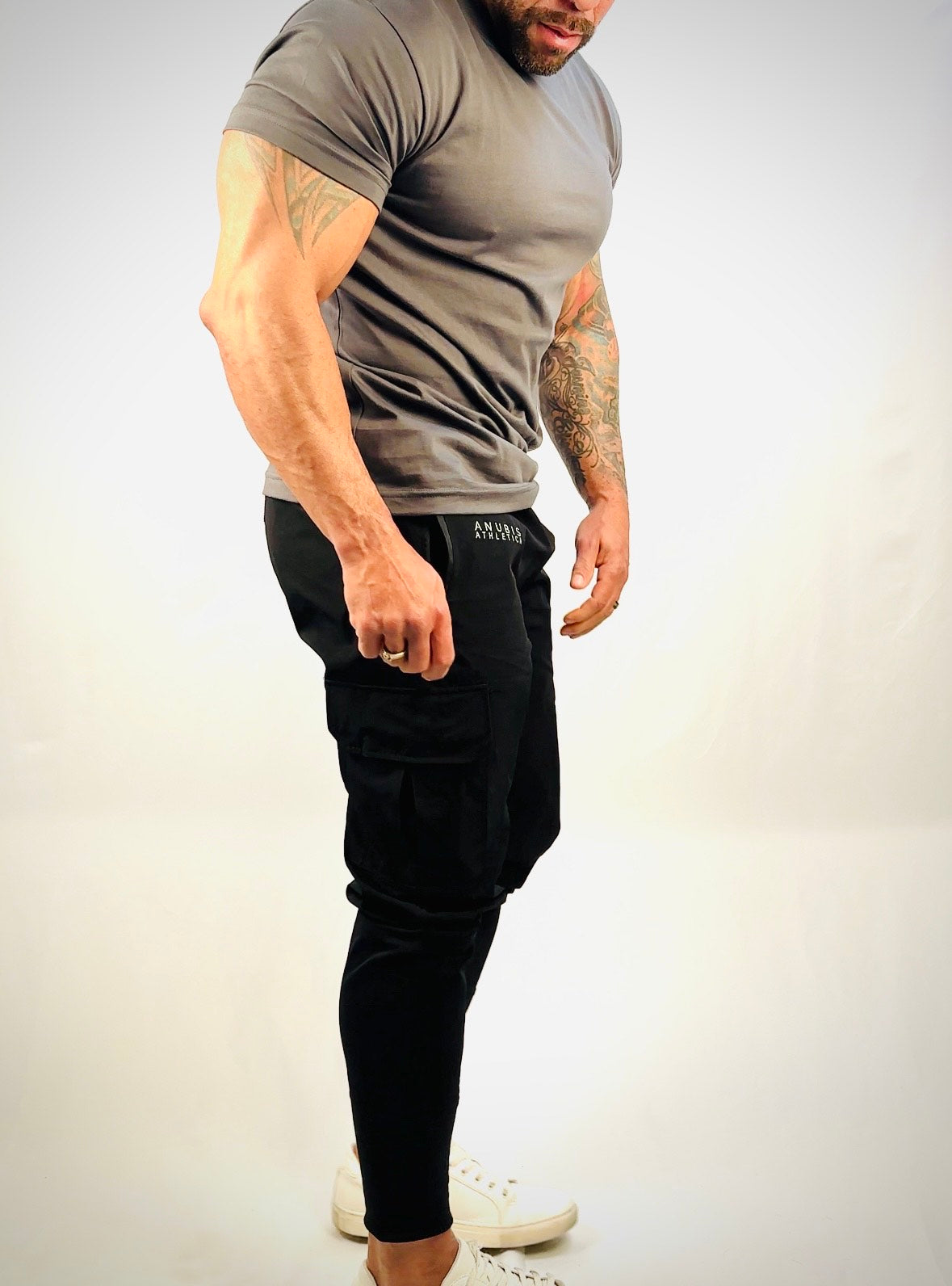 male model wearing black cargo joggers