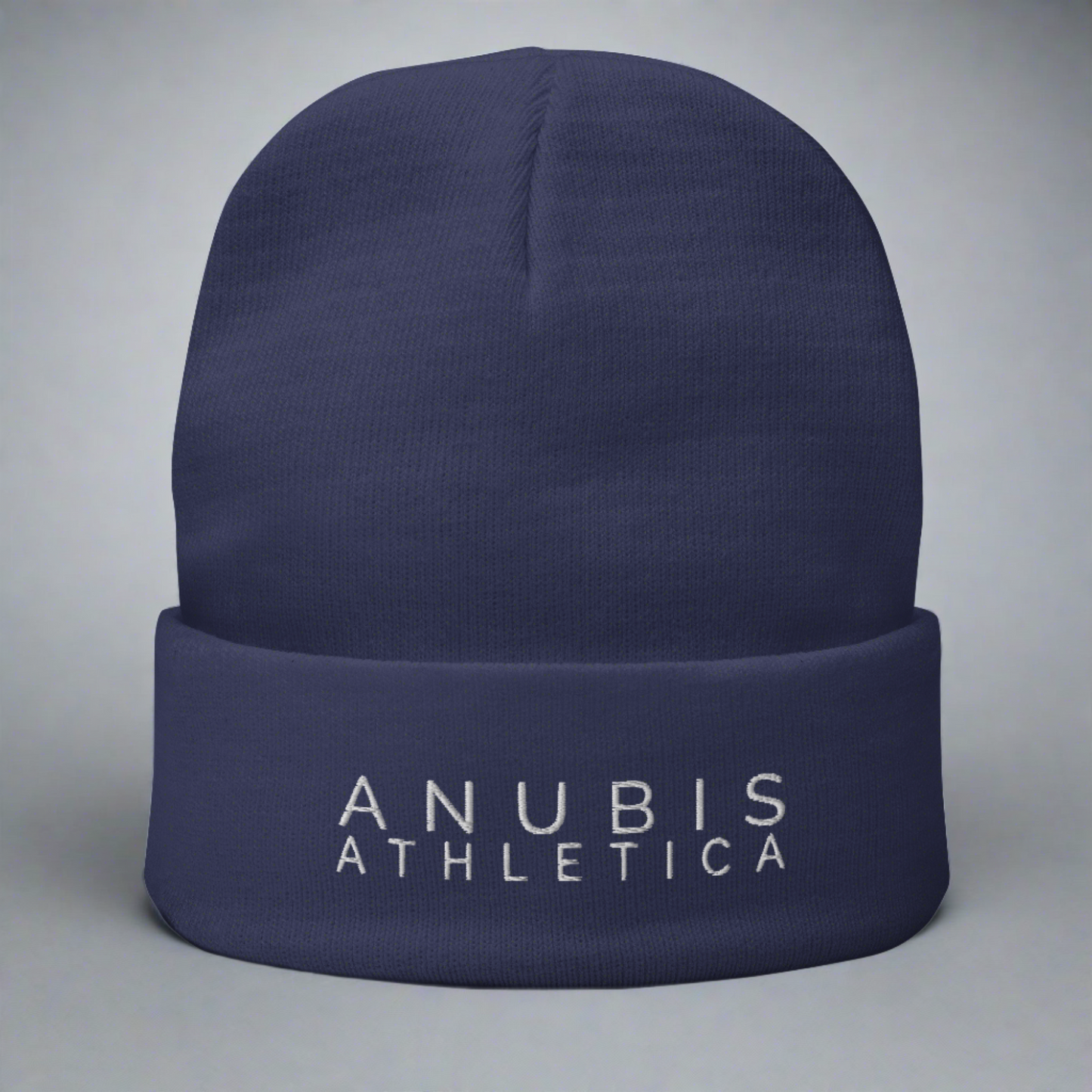 Knit beanie with the words Anubis Athletica embroidered on the front . Beanie color is blue