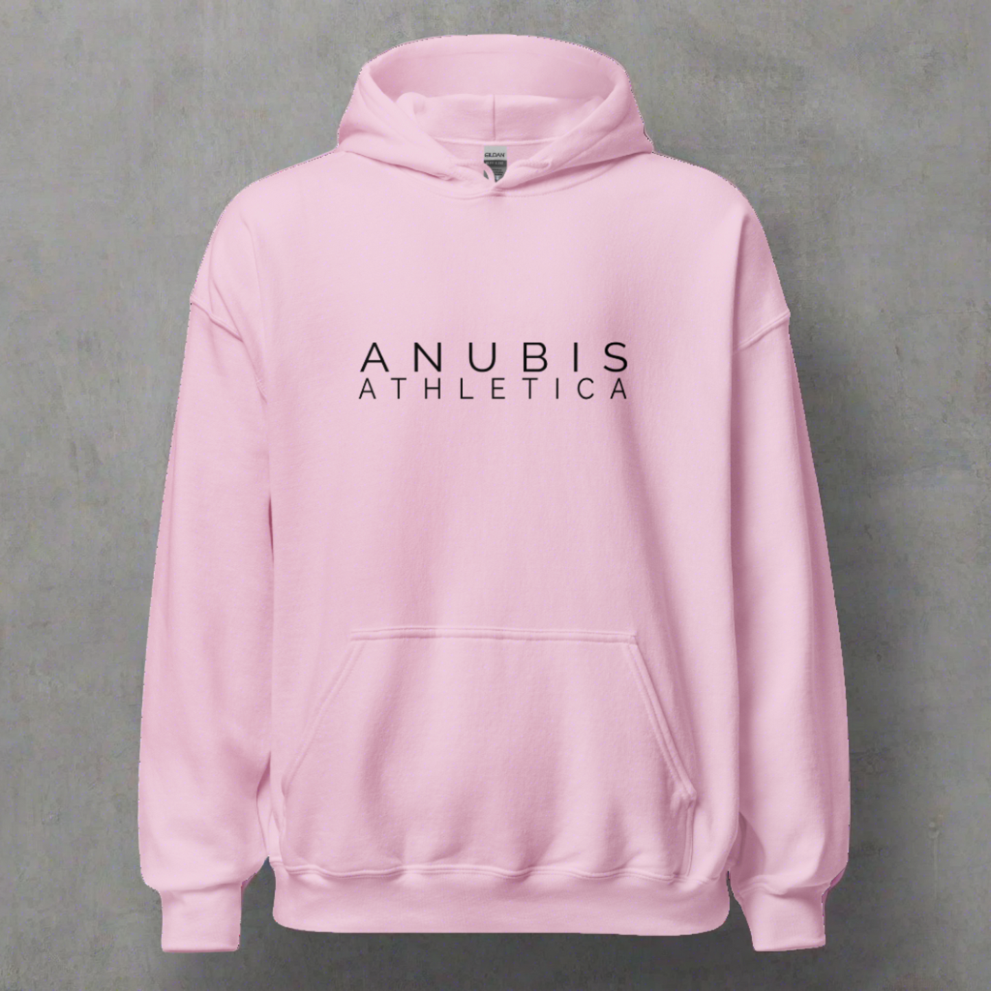 A pull over hoodie with the words Anubis Athletica printed in black on the front. Hoodie is color pink