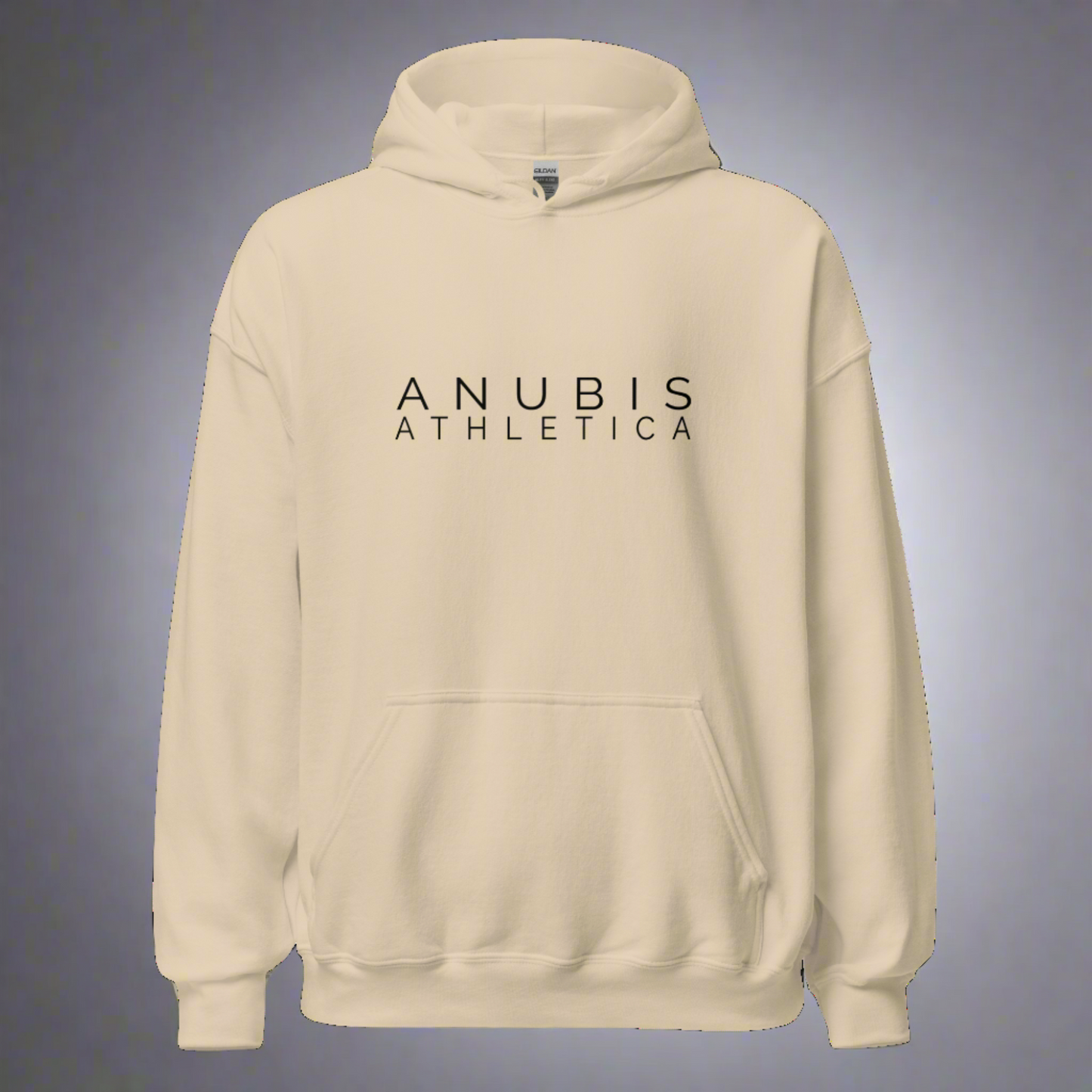 A pull over hoodie with the words Anubis Athletica printed in black on the front. Hoodie is color sand