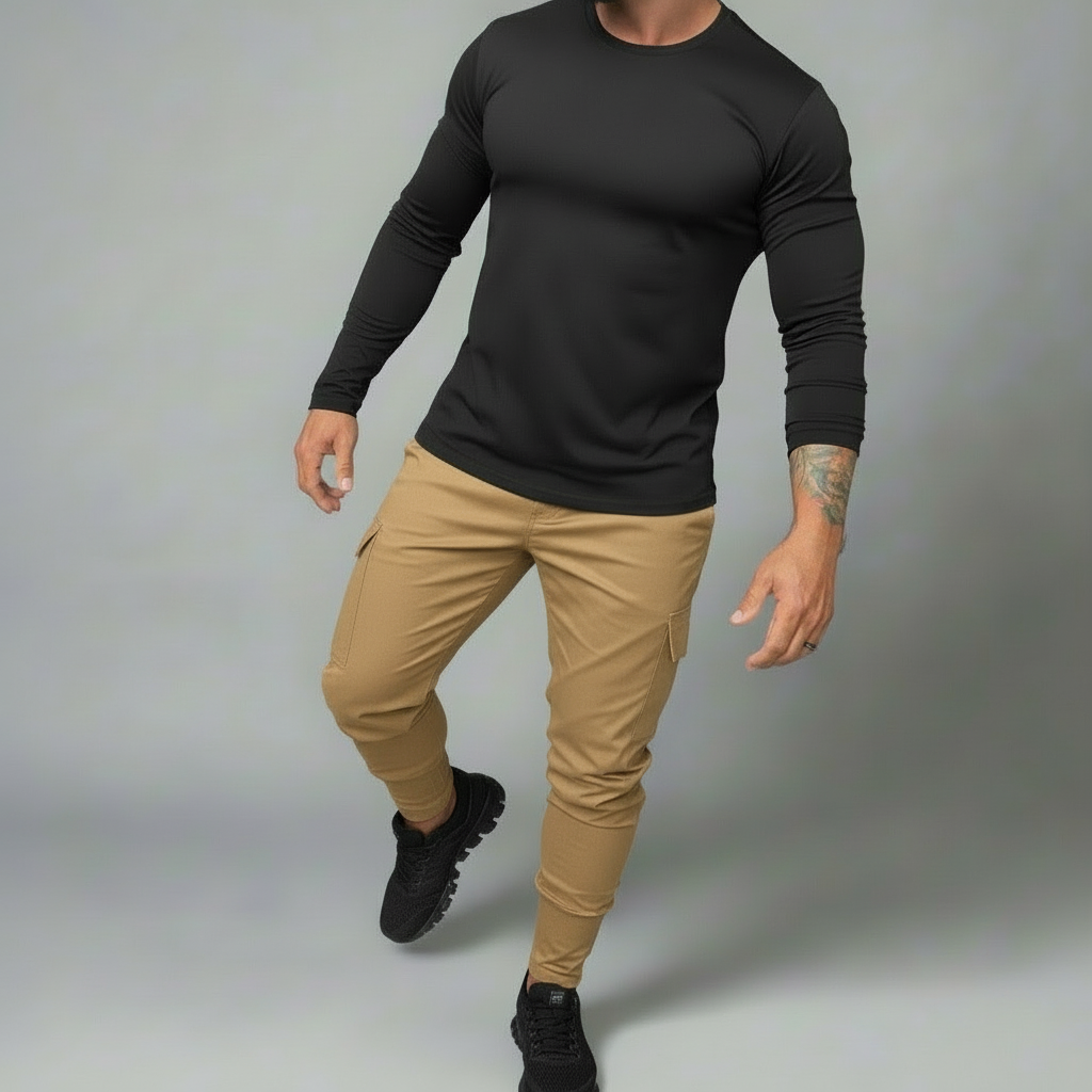 Person wearing a black long-sleeve shirt and beige pants on a gray background